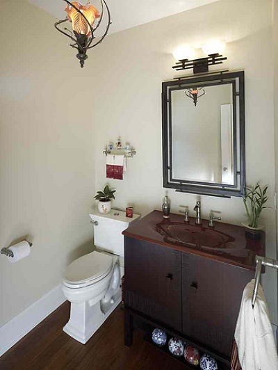 Half Bath with Elegant Mirror and Light Fixtures Half Bath with Elegant Mirror and Light Fixtures