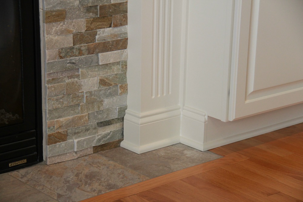 Interior Trim Detail Design Ideas Photos And Descriptions A Dry Stack Stone Veneer Surround Melds With The Oak Hardwood Flooring And White Painted Cabinets