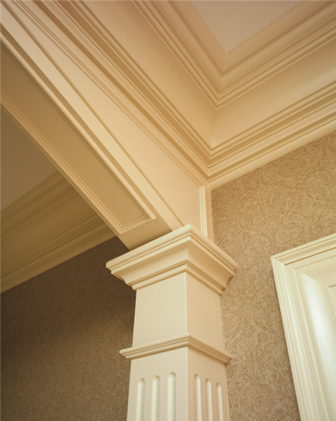 The fluted column and multi-step moldings are a beautiful feature in this home.