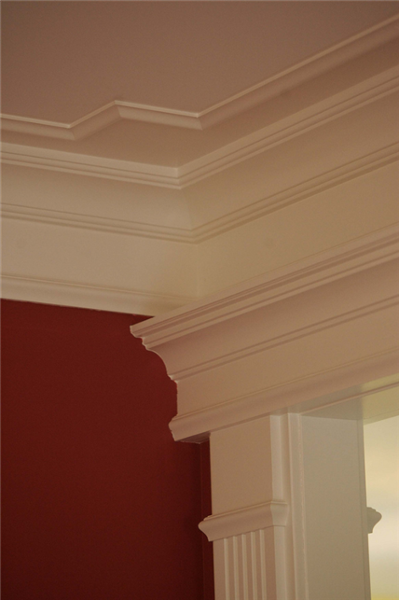 The fluted casing and crown molding add an elegant accent to this room.