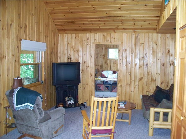 The knotty pine tongue and groove walls finish off this room but still keep the charm of this lake side cottage.