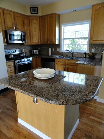 kitchen island with curved Cambria countertop