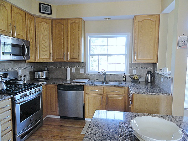 kitchen with Cambria countertops and hardwood floors