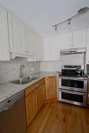 Kitchen-with-Oak-Floors-and-Stainless-Steel-Appliances
