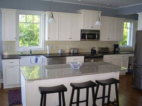 White-Farmhouse-Kitchen-with-Granite-Island