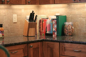 kitchen-with-granite-countertop-and-under-cabinet-lighting