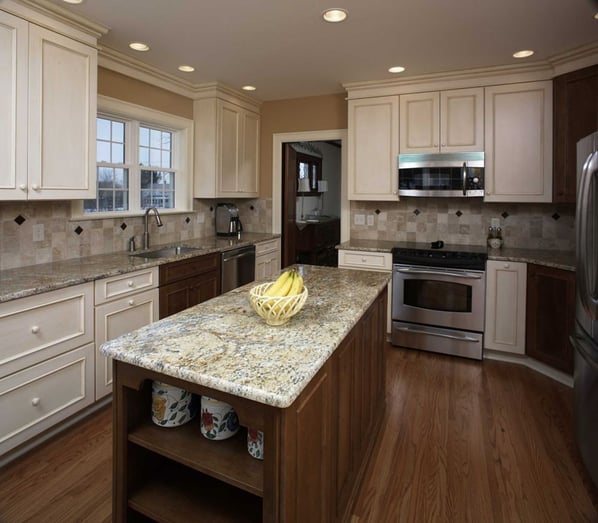 Kitchen with mixed finish cabinets