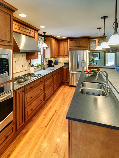 Kitchen with wood stained cabinets and raised panel doors
