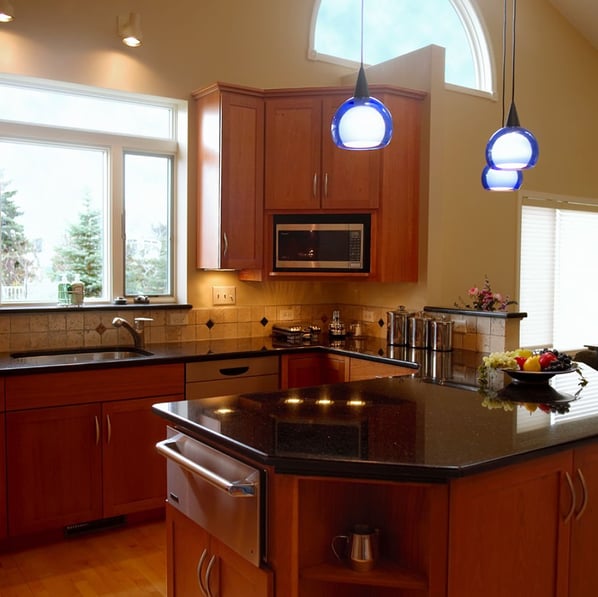 open kitchen with partial wall for cabinets