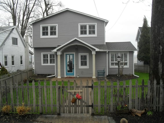 Vinyl-Sidiing-with-New-Entry-and-Roof.jpg
