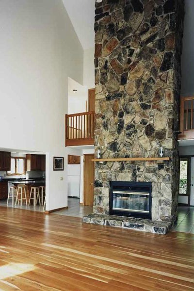 floor-to-ceiling stone fireplace