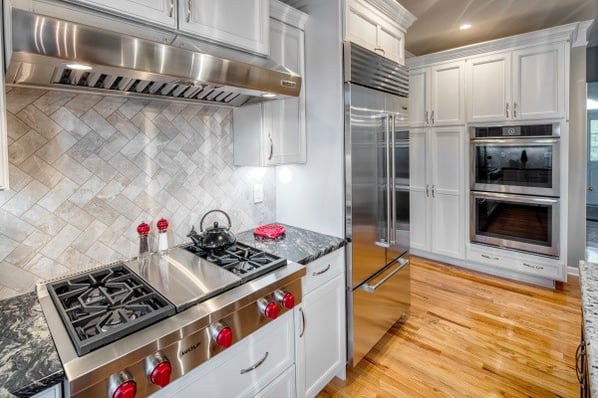 kitchen with herringbone pattern backsplash
