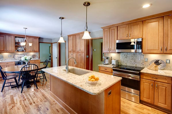 kitchen with island and maple cabinets