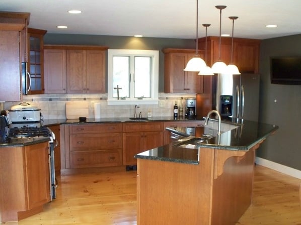 kitchen with tiered island and two sinks