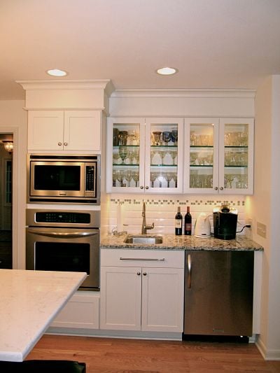 Kitchen bar area with in-cabinet and under-cabinet lighting