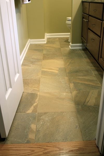 master bath with 12-by-12 inch tile flooring