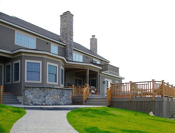 rear exterior with stone wall and chimney