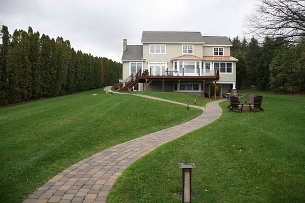 universal design lakefront home backyard view