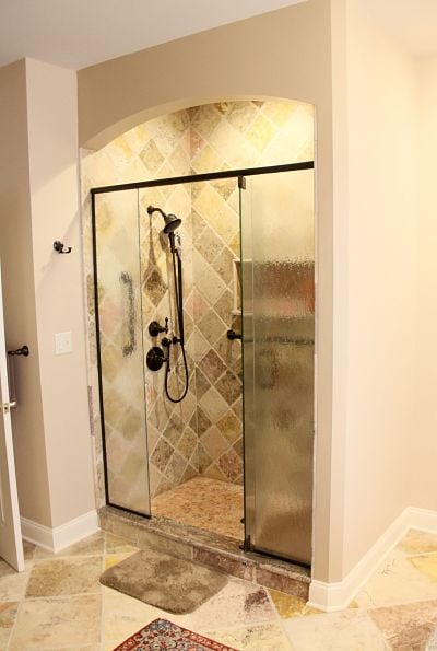 walk-in-shower-with-arch-and-decorative-tile.jpg