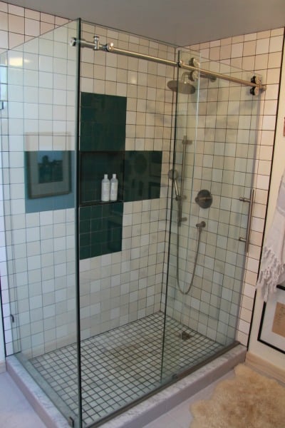 walk-in shower with sliding glass door