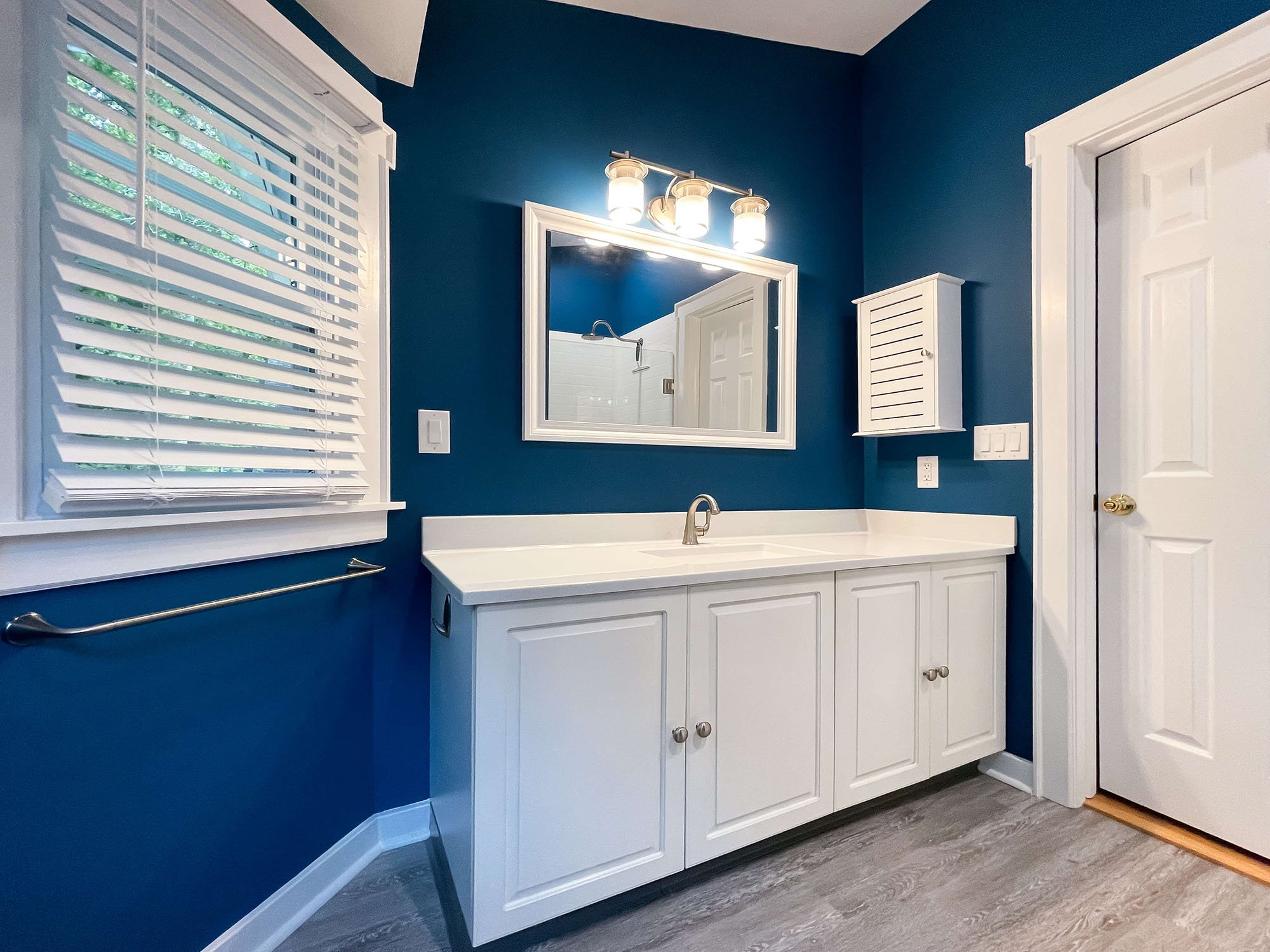 bathroom-remodel-blue-walls-white-vanity-1