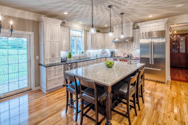 Bright lights, and complimenting Cambria counter tops and island.  Spacious seating at the island and stainless steel appliances give this kitchen an easy flow and clean look. 