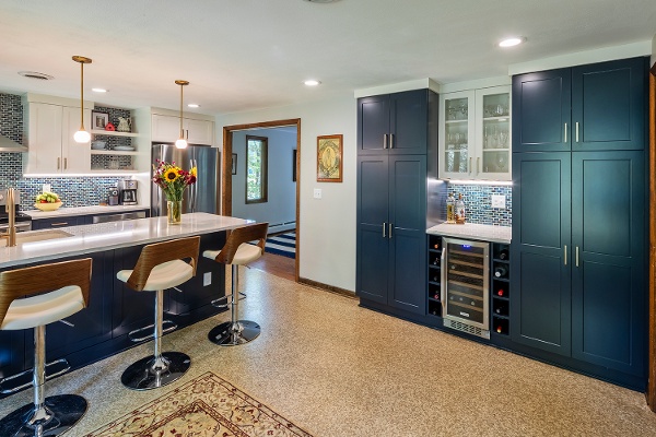 This kitchen gives the classic nautical theme an update!  Making the most of the space with built in pantry storage and sleek modern seating at the hub of the kitchen.