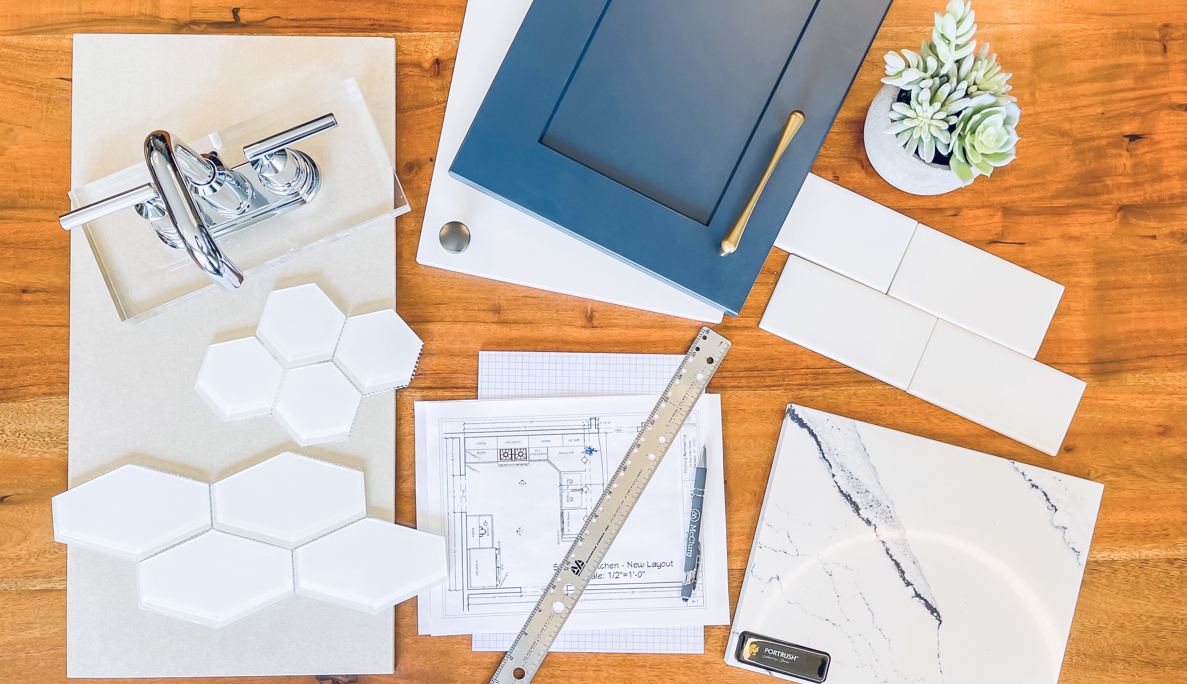 Flat lay photo of selections - tile, faucet, countertop, cabinets, etc.