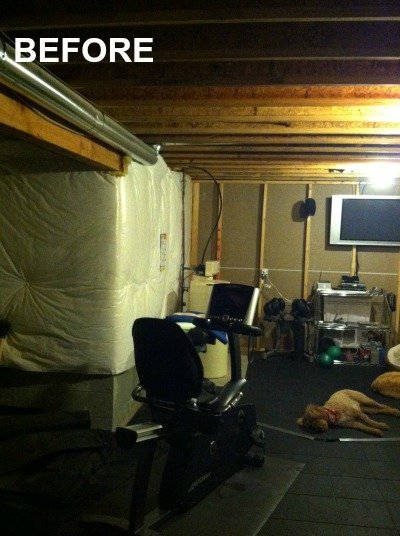 BEFORE-unfinished-basement-with-exercise-equipment