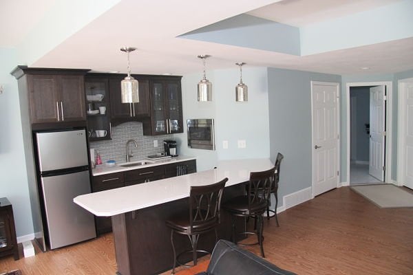 lower level kitchenette with vinyl flooring