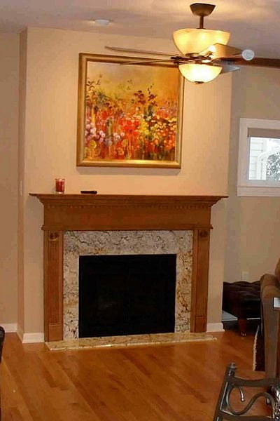 fireplace-with-wood-mantel-and-quartz-surround