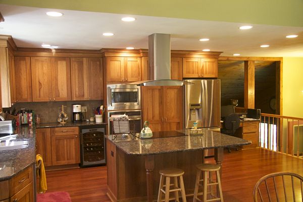 kitchen-with-island-cooktop-and-vent-hood