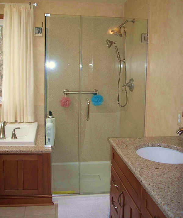 Showers can be enclosed entirely by custom cut glass making the shower seem open to the entire bathroom.