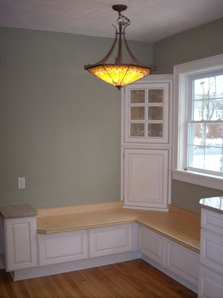 Once a table is added to this built-in window seat there will be plenty of seating in this small kitchen space.